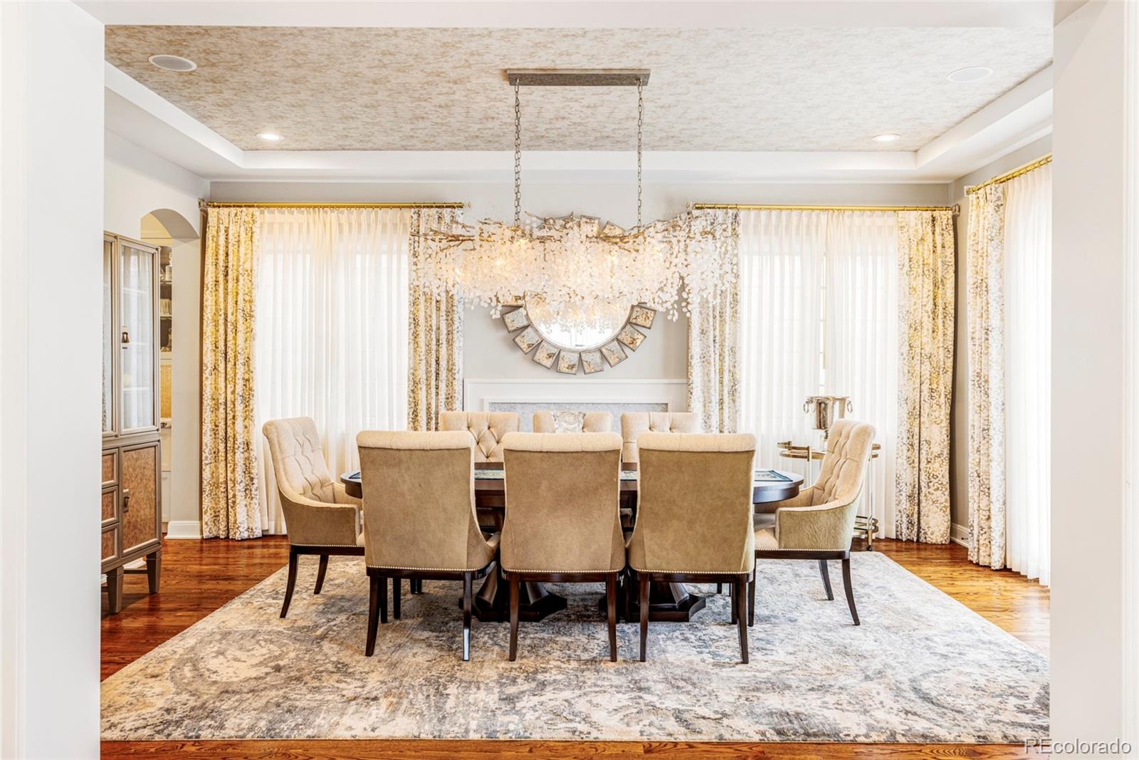 411 Cook Street Denver, CO 80206 - Photo 13 of 40 a view of a dining room with furniture window and wooden floor
