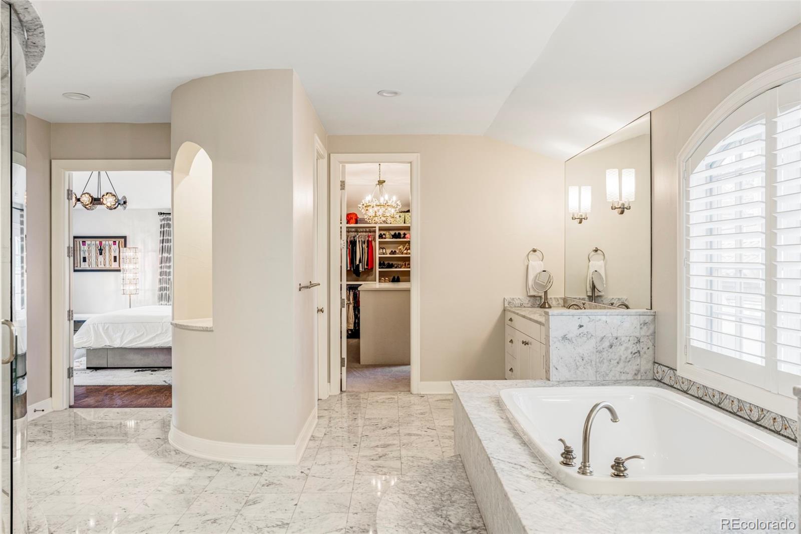 411 Cook Street Denver, CO 80206 - Photo 23 of 40 a bathroom with bathtub and a shower