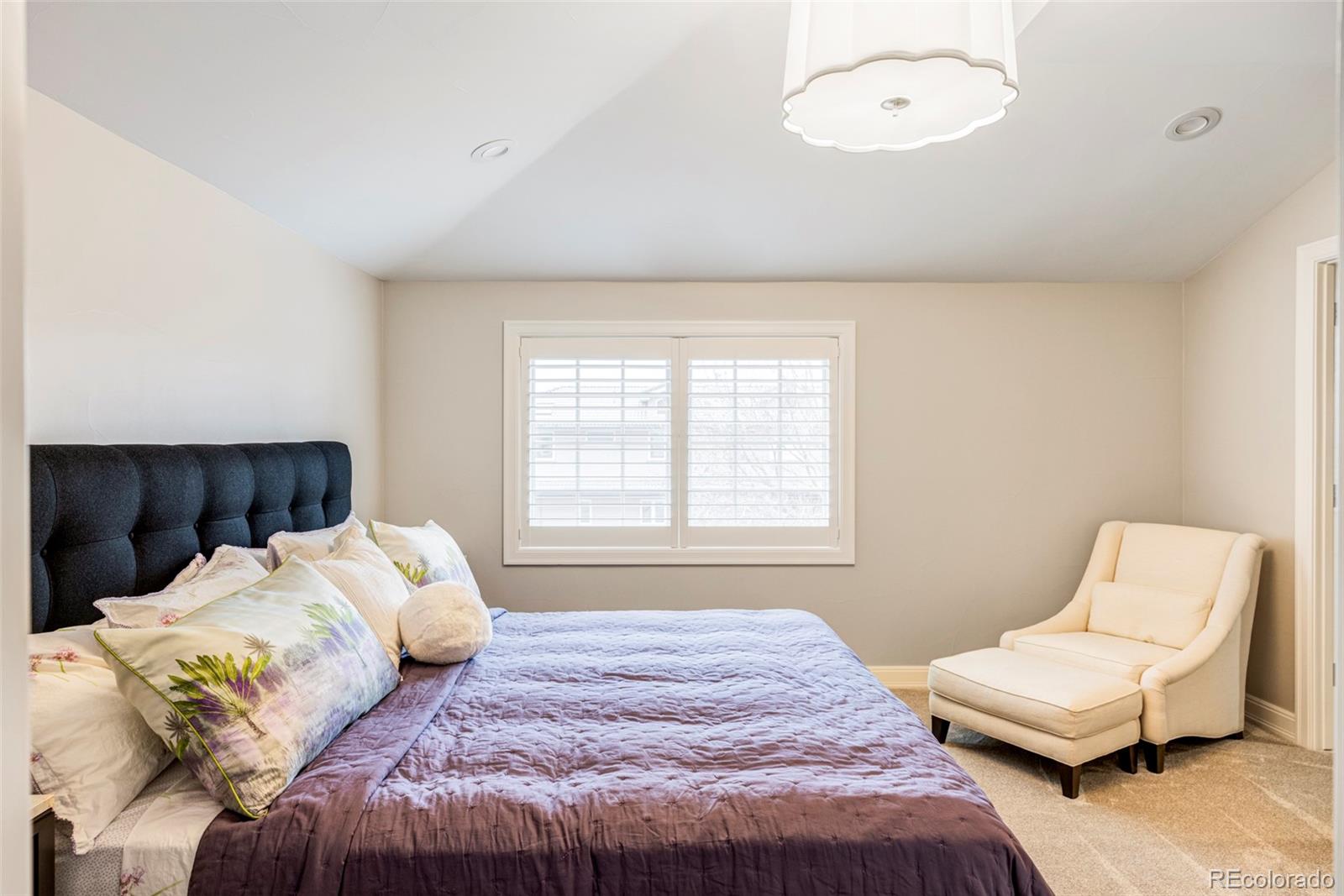 411 Cook Street Denver, CO 80206 - Photo 26 of 40 a bedroom with a bed and a couch