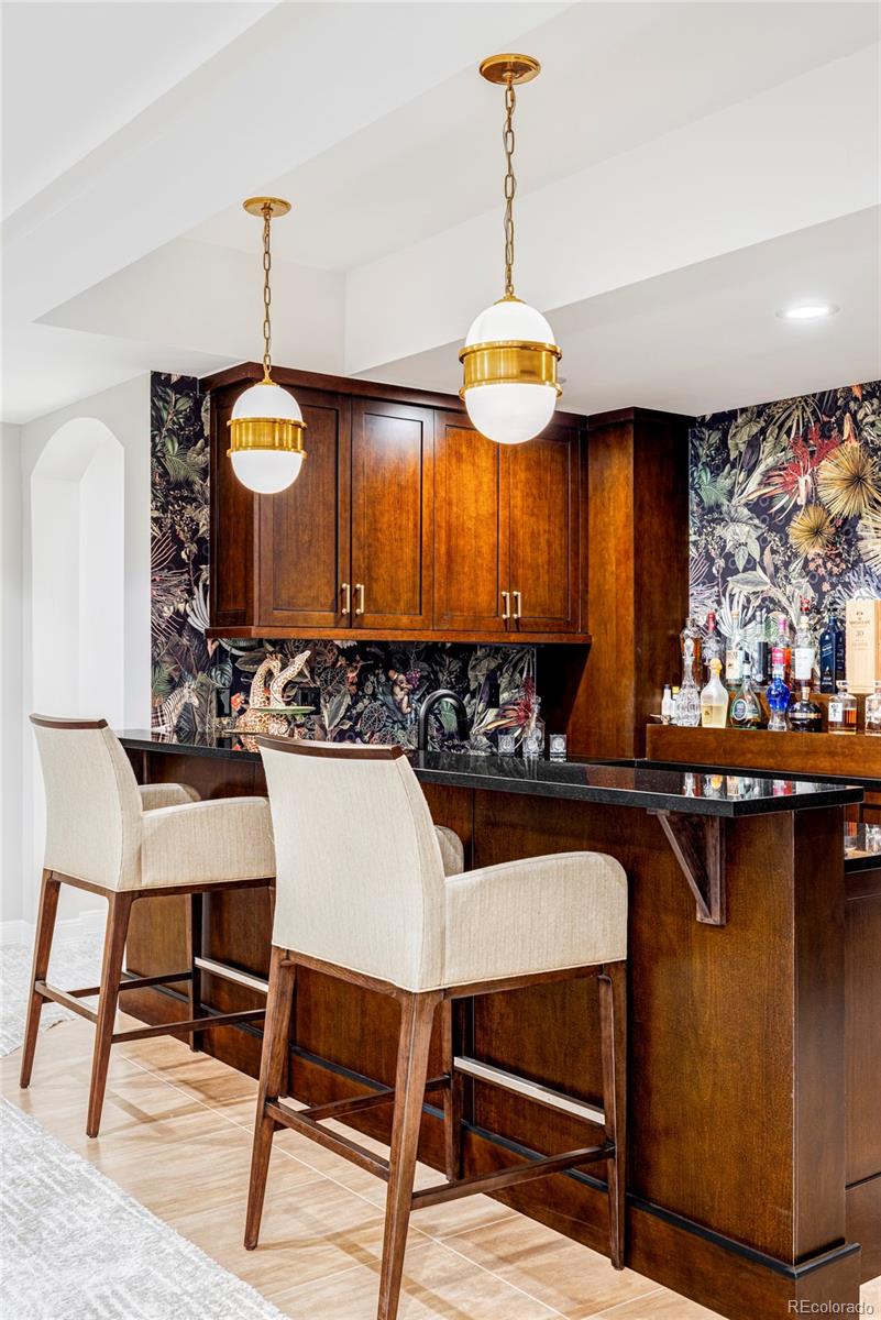 411 Cook Street Denver, CO 80206 - Photo 34 of 40 a view of a kitchen area with furniture and chandelier