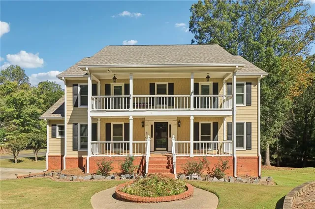 a front view of a house with a yard table and chairs