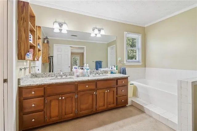 a bathroom with a sink a vanity and a mirror