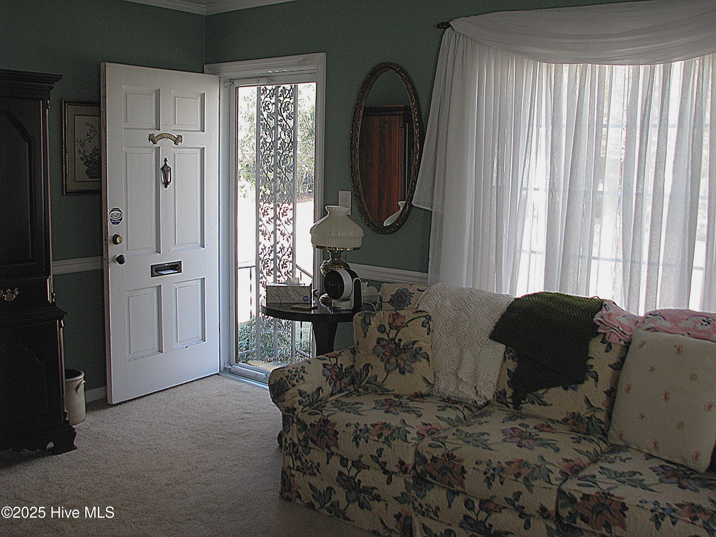 Living room looking toward front door - new storm door