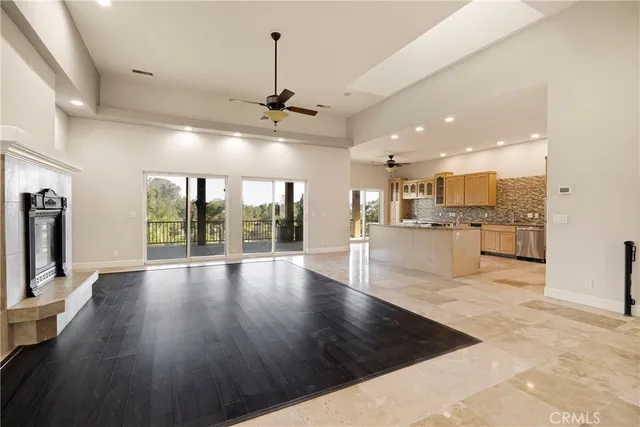 a view of an empty room with chandelier