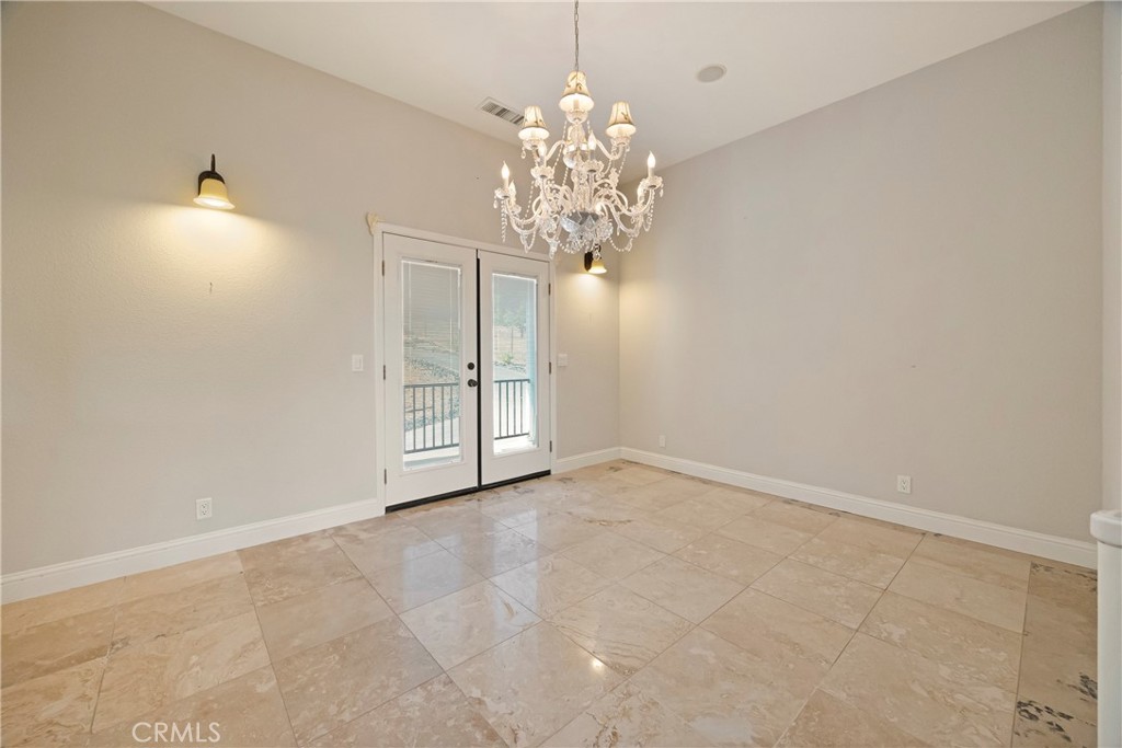 129 Valley Ridge Drive Paradise, CA 95969 - Photo 23 of 66 a view of an empty room with chandelier