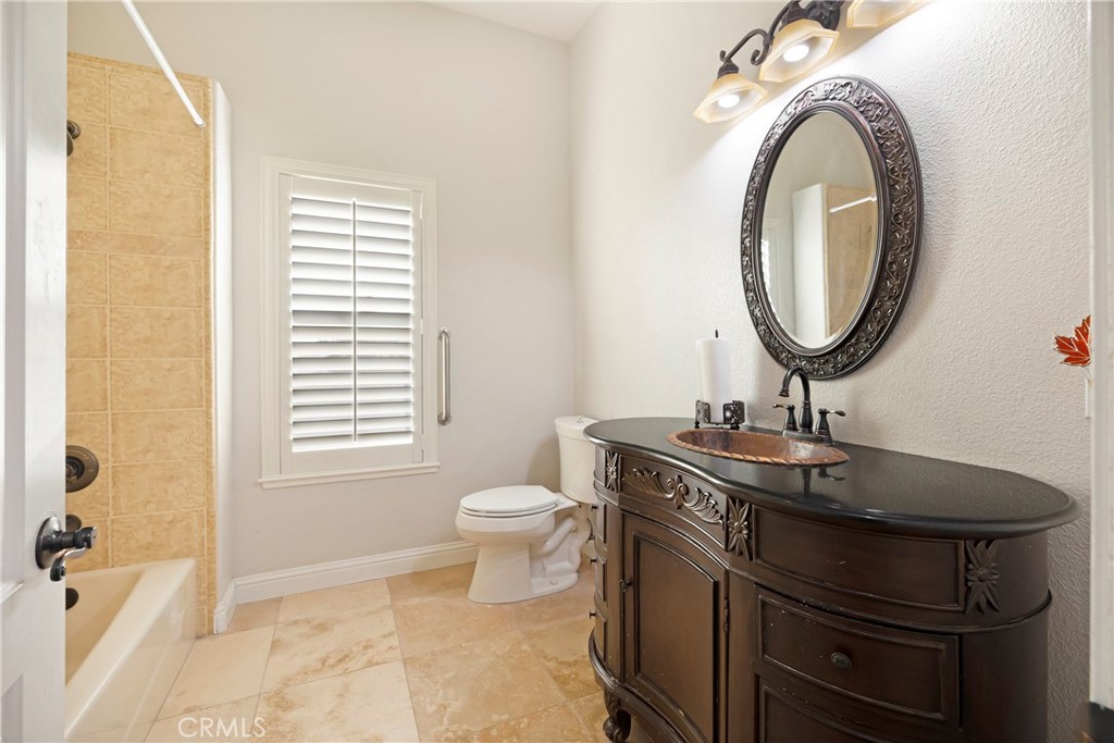 129 Valley Ridge Drive Paradise, CA 95969 - Photo 37 of 66 a bathroom with a sink a toilet and a mirror