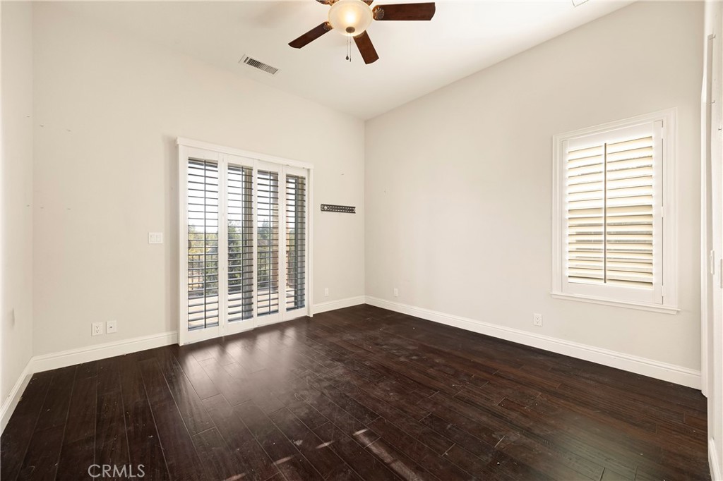 129 Valley Ridge Drive Paradise, CA 95969 - Photo 38 of 66 an empty room with wooden floor fan and windows