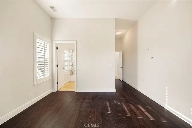 a view of a hallway with washer and dryer