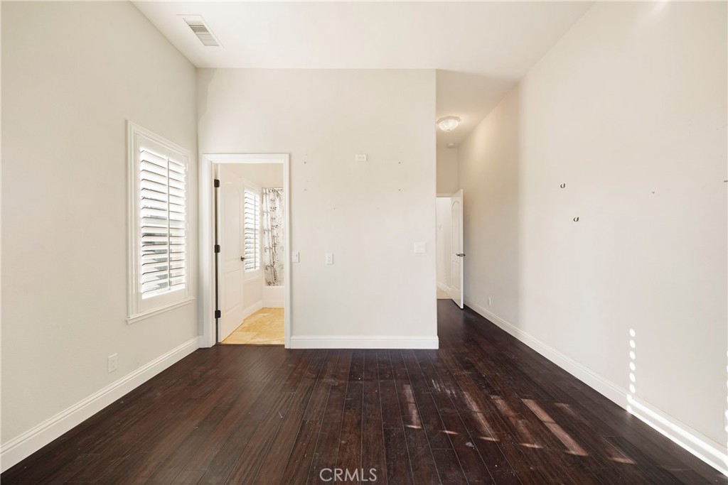 129 Valley Ridge Drive Paradise, CA 95969 - Photo 39 of 66 an empty room with wooden floor and windows