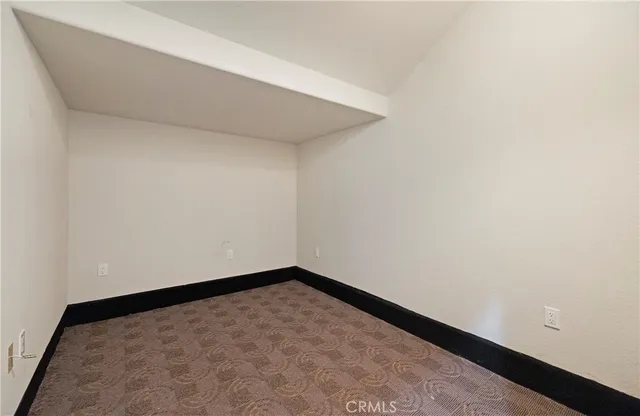 a view of a balcony with wooden floor