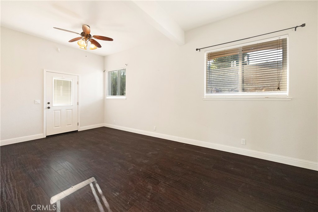 129 Valley Ridge Drive Paradise, CA 95969 - Photo 43 of 66 a view of an empty room with wooden floor and a window
