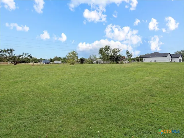 a view of an ocean and a houses