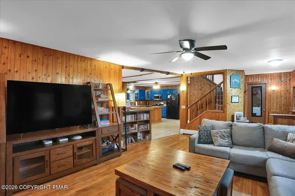 a living room with furniture and a flat screen tv