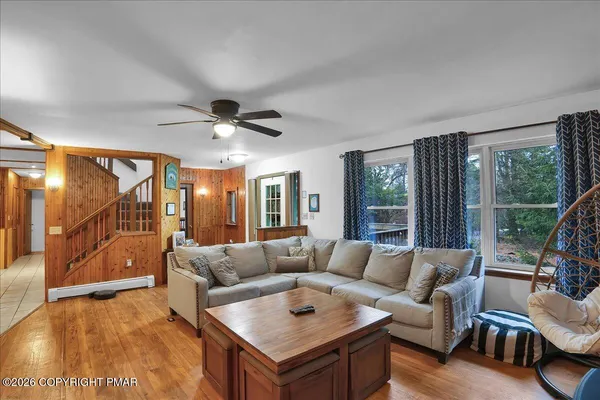 a living room with furniture and a large window