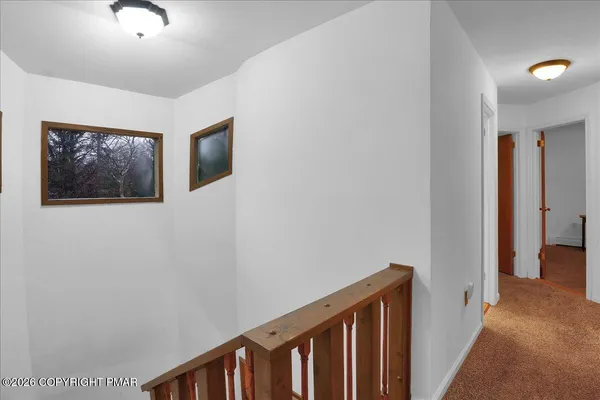 a view of a hallway with workspace