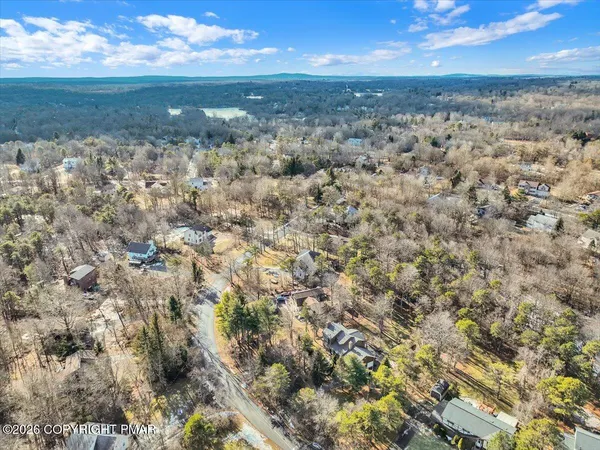 a aerial view of a house with a yard