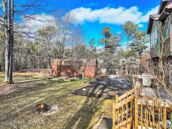 a view of a house with a tree