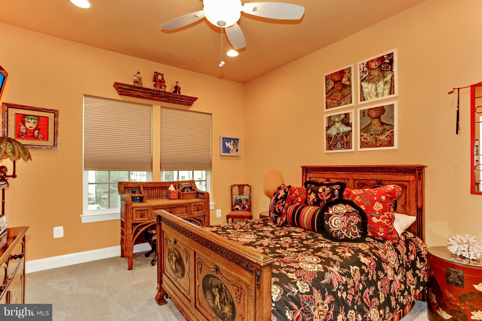 3632 Spring Hollow Lane Frederick, MD 21704 - Photo 12 of 30 a bedroom with a bed and a table in it