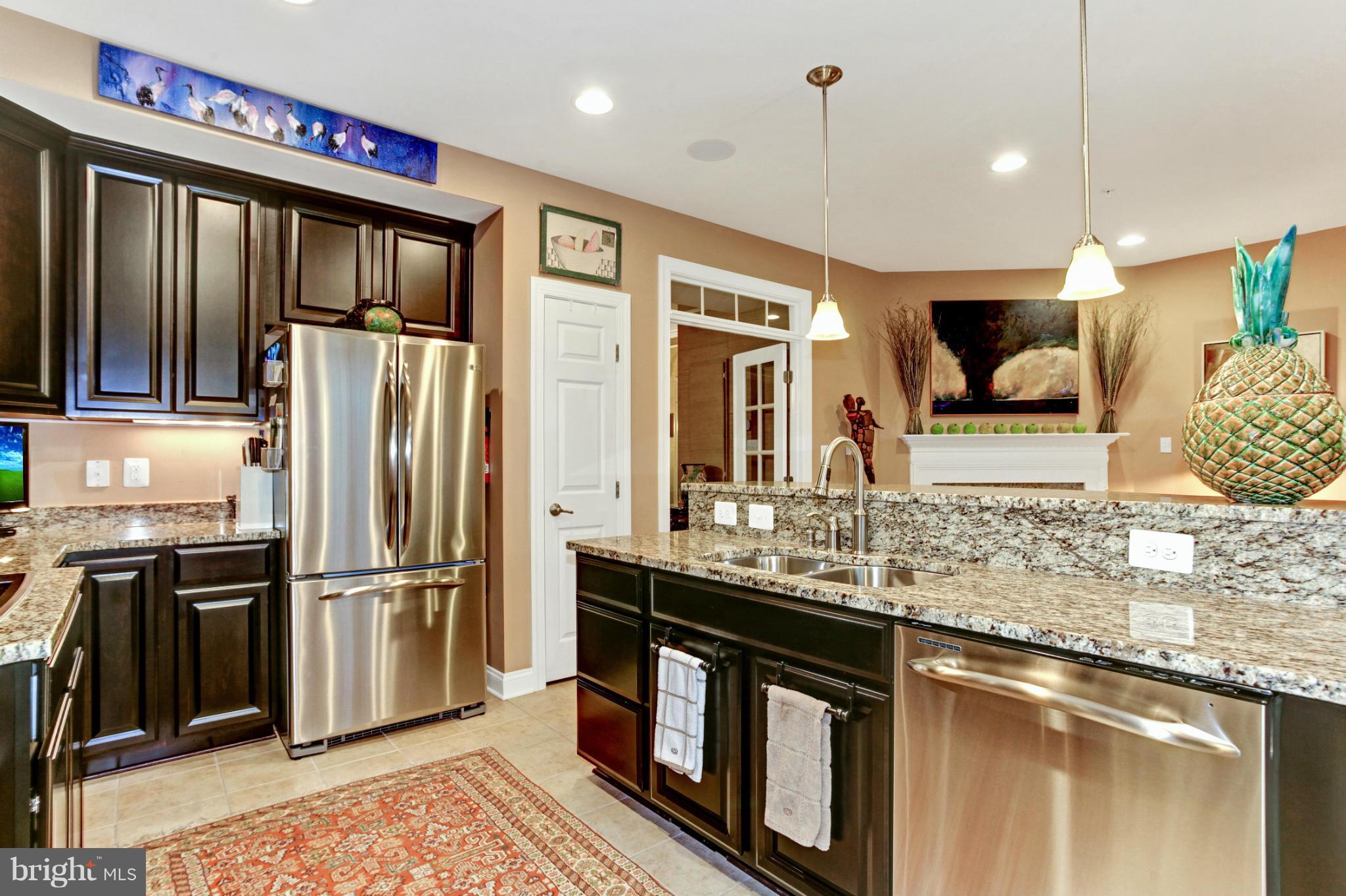 3632 Spring Hollow Lane Frederick, MD 21704 - Photo 21 of 30 a kitchen with stainless steel appliances granite countertop a refrigerator and a sink