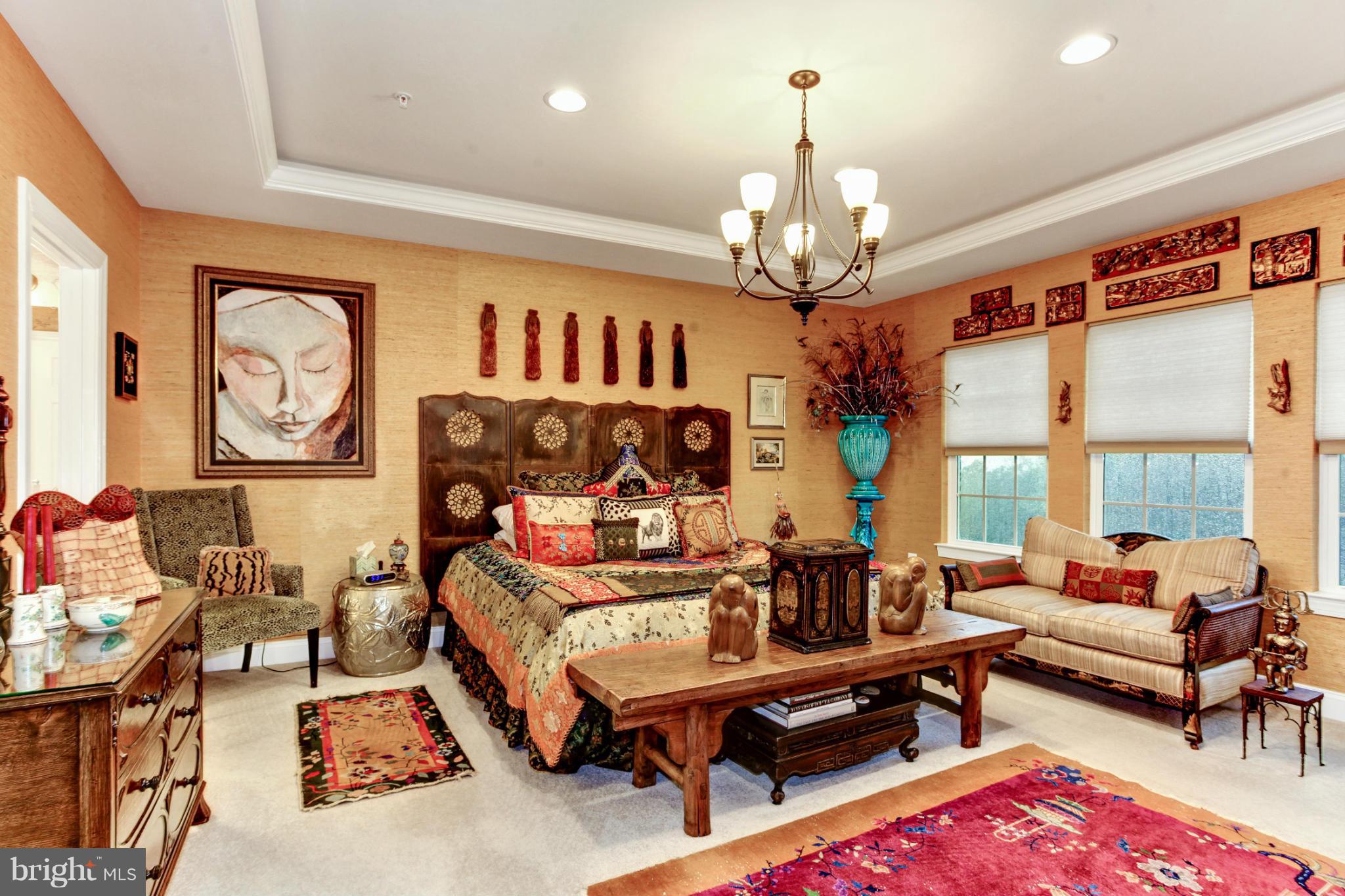 3632 Spring Hollow Lane Frederick, MD 21704 - Photo 28 of 30 a living room with patio furniture and a chandelier