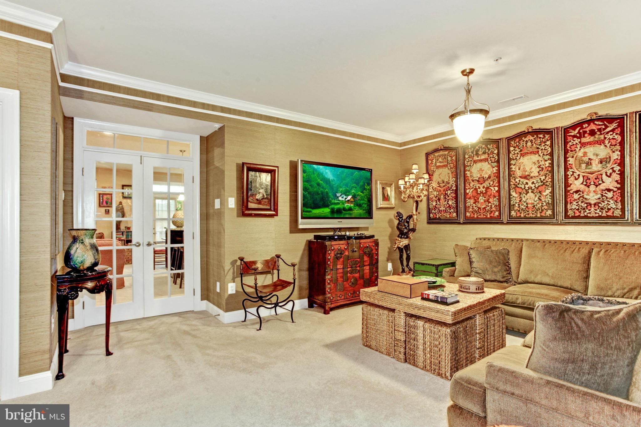 3632 Spring Hollow Lane Frederick, MD 21704 - Photo 10 of 30 a living room with furniture a flat screen tv and a dining table
