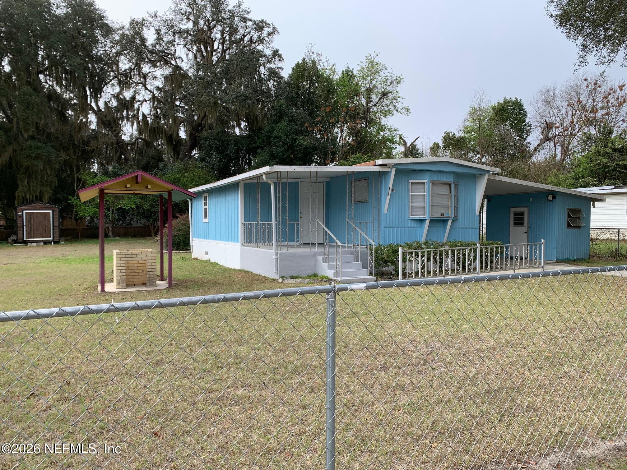115 Sawyer Street Interlachen, FL 32148 - Photo 13 of 24 a front view of a house with garden