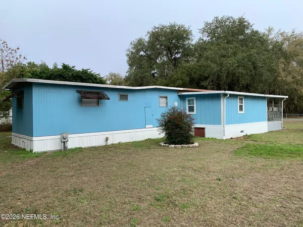 a house with trees in the background