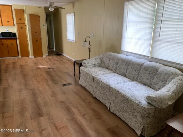 a living room with a couch and a window