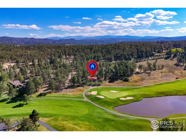 a view of a backyard of the house