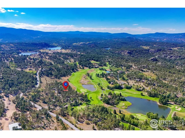 a view of a golf course with a swimming pool