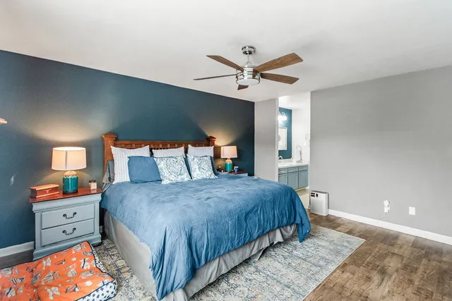 a bedroom with a bed and a tv