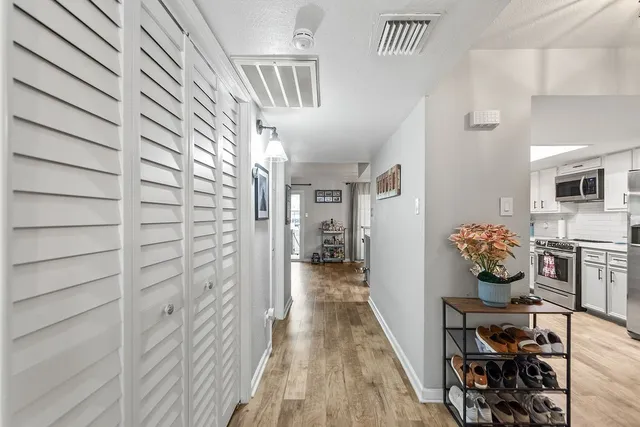 a kitchen with stainless steel appliances granite countertop a refrigerator stove and sink