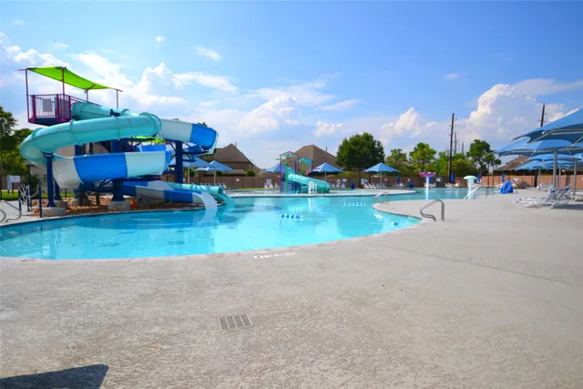 a childrens park with lots of swings and slides
