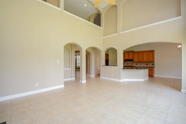 a view of an empty room with glass door