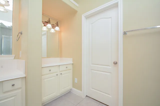 a view of bathroom with a sink mirror and