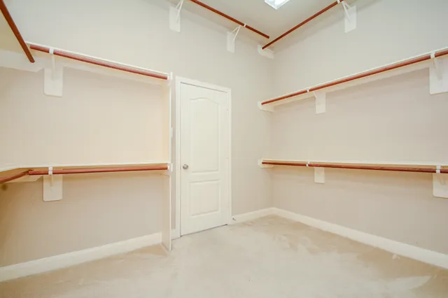 a view of an empty walk in closet