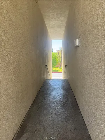 a view of a hallway with a window
