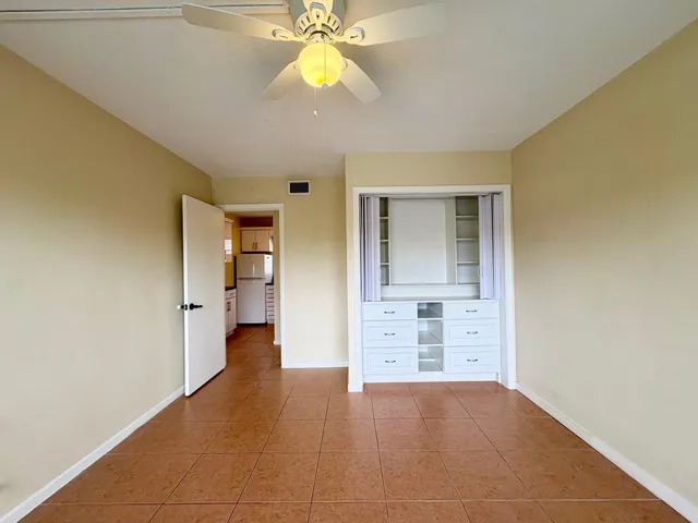wooden floor in an empty room and a window