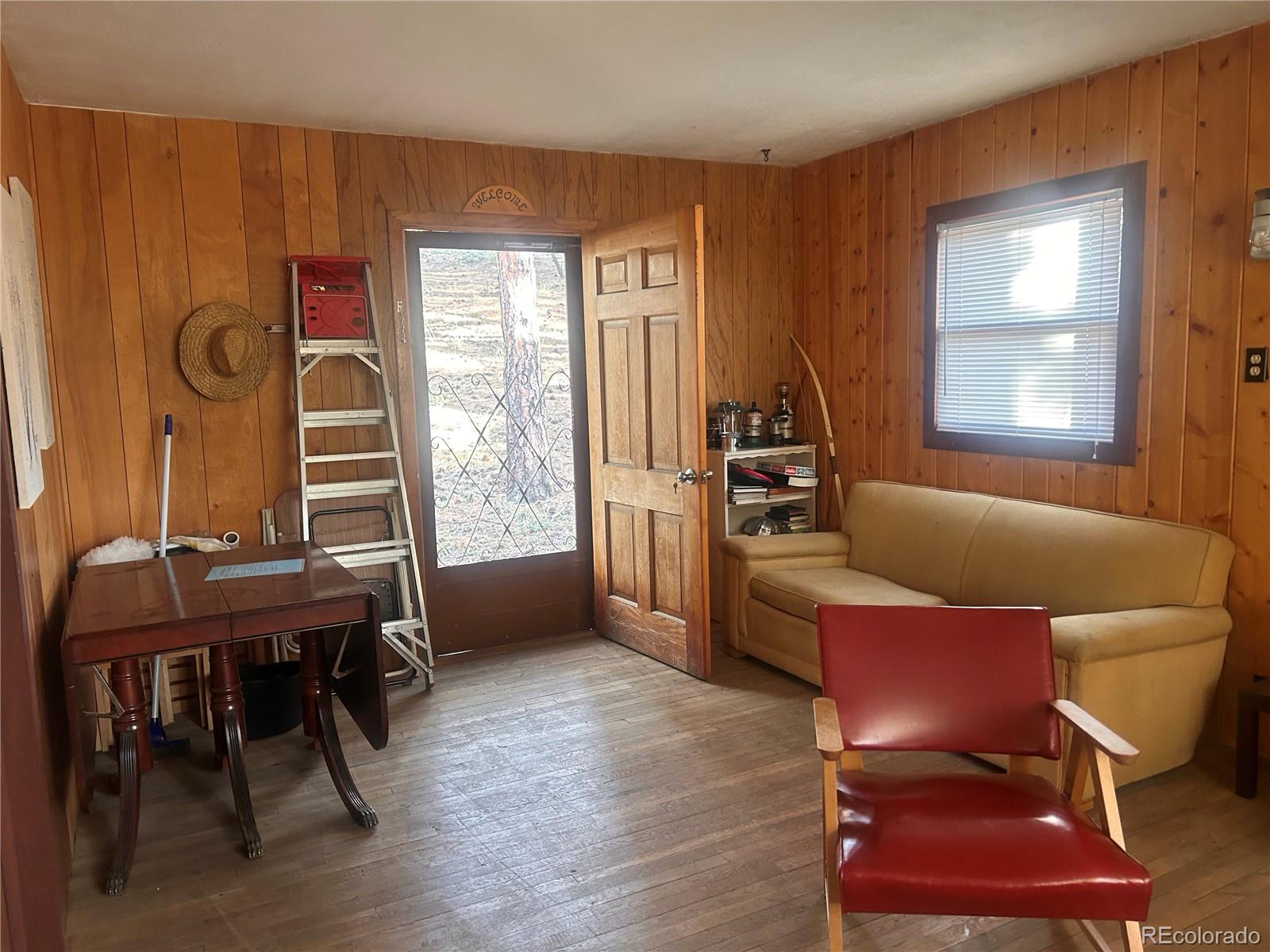 861 Happy Top Road Bailey, CO 80421 - Photo 13 of 29 a living room with furniture and a window