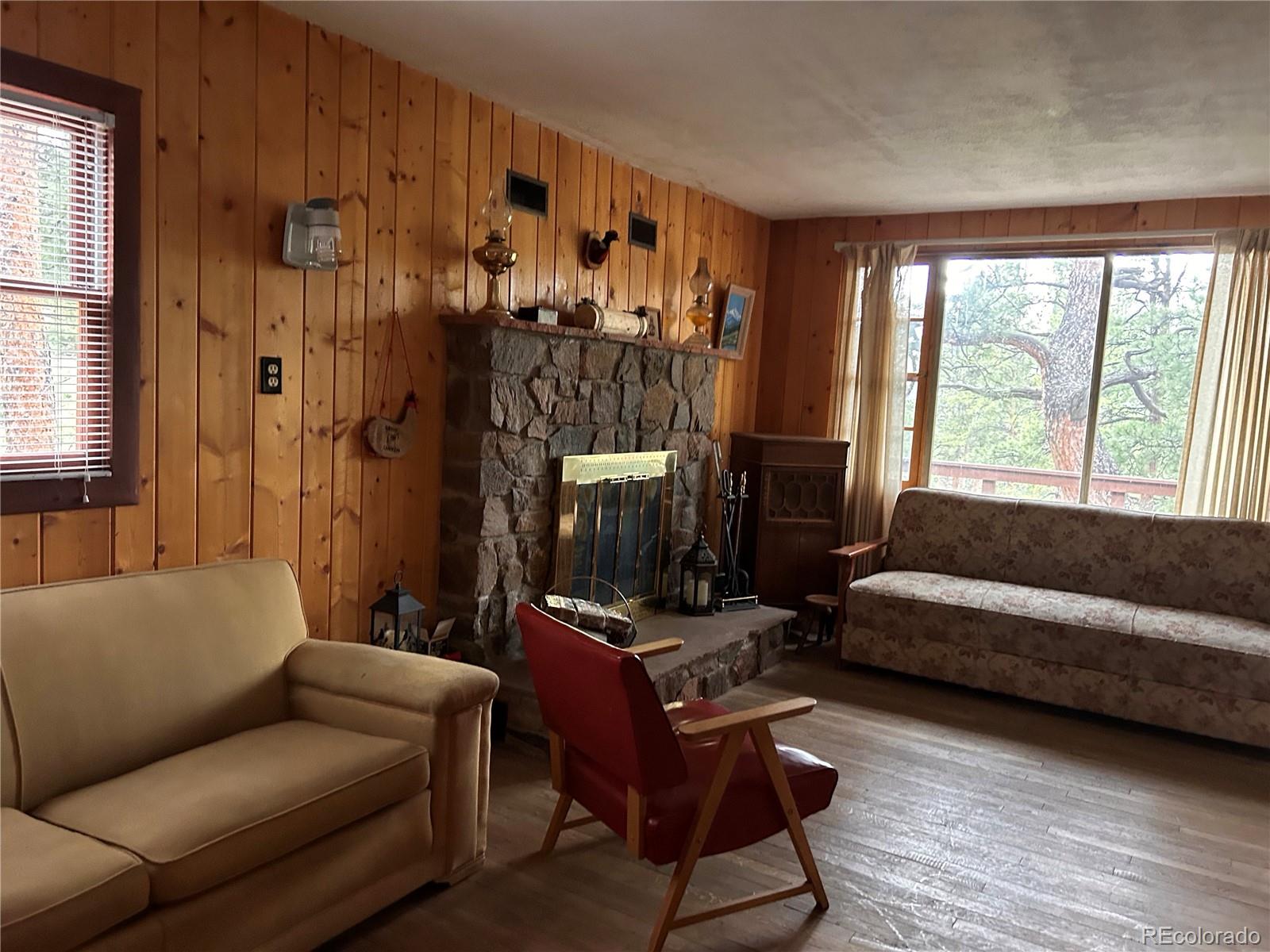 861 Happy Top Road Bailey, CO 80421 - Photo 15 of 29 a living room with furniture and a window