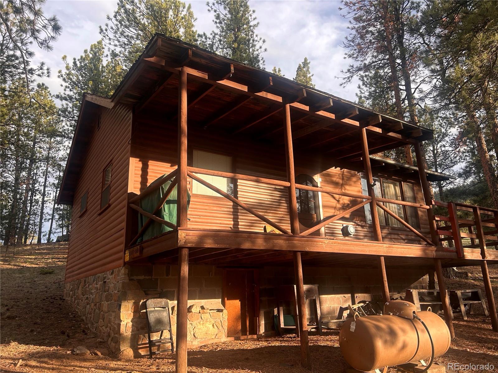 861 Happy Top Road Bailey, CO 80421 - Photo 28 of 29 a view of a chairs and tables in the patio