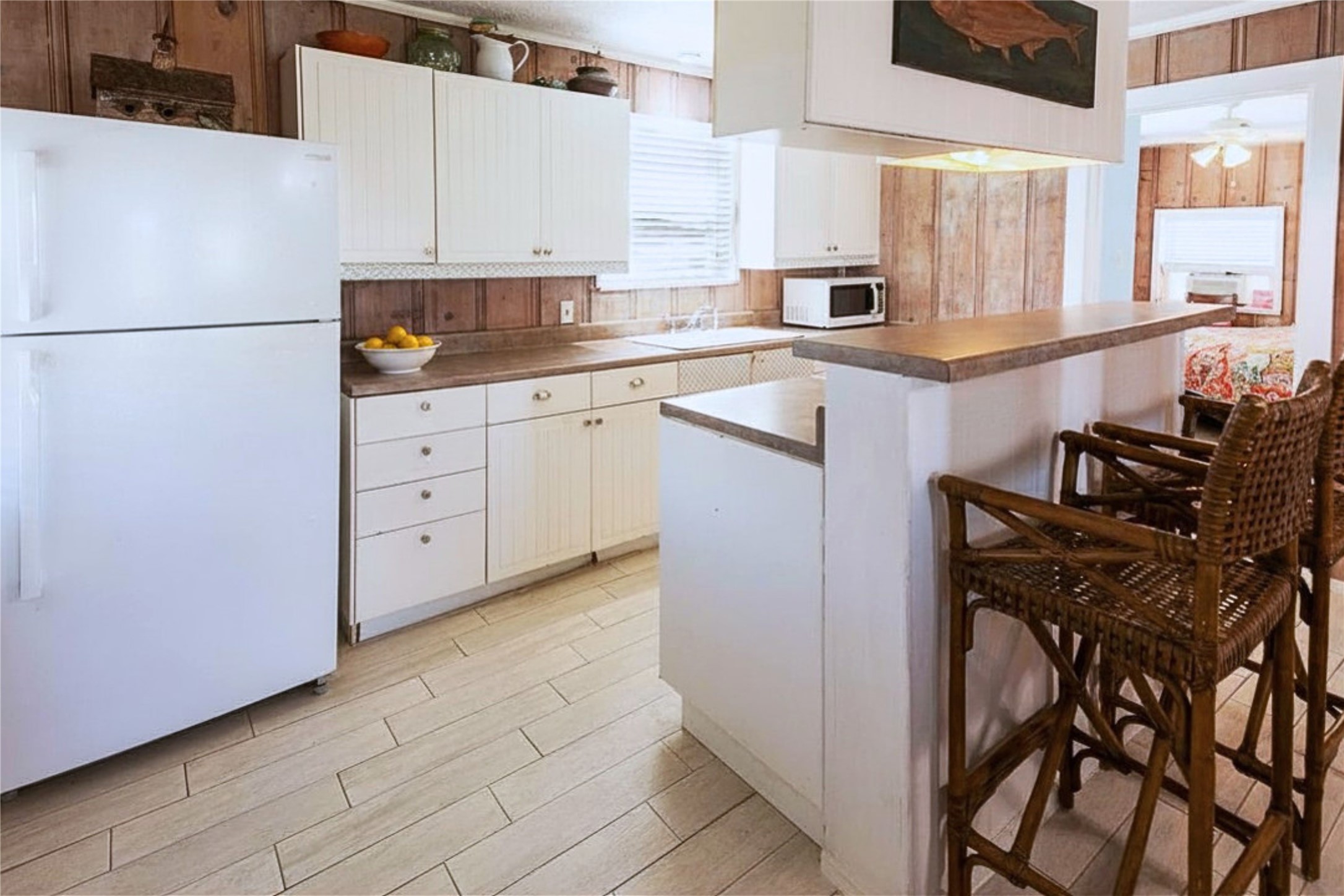 959 South East Road Crystal Beach, TX 77650 - Photo 13 of 20 a kitchen with stainless steel appliances a refrigerator sink and cabinets