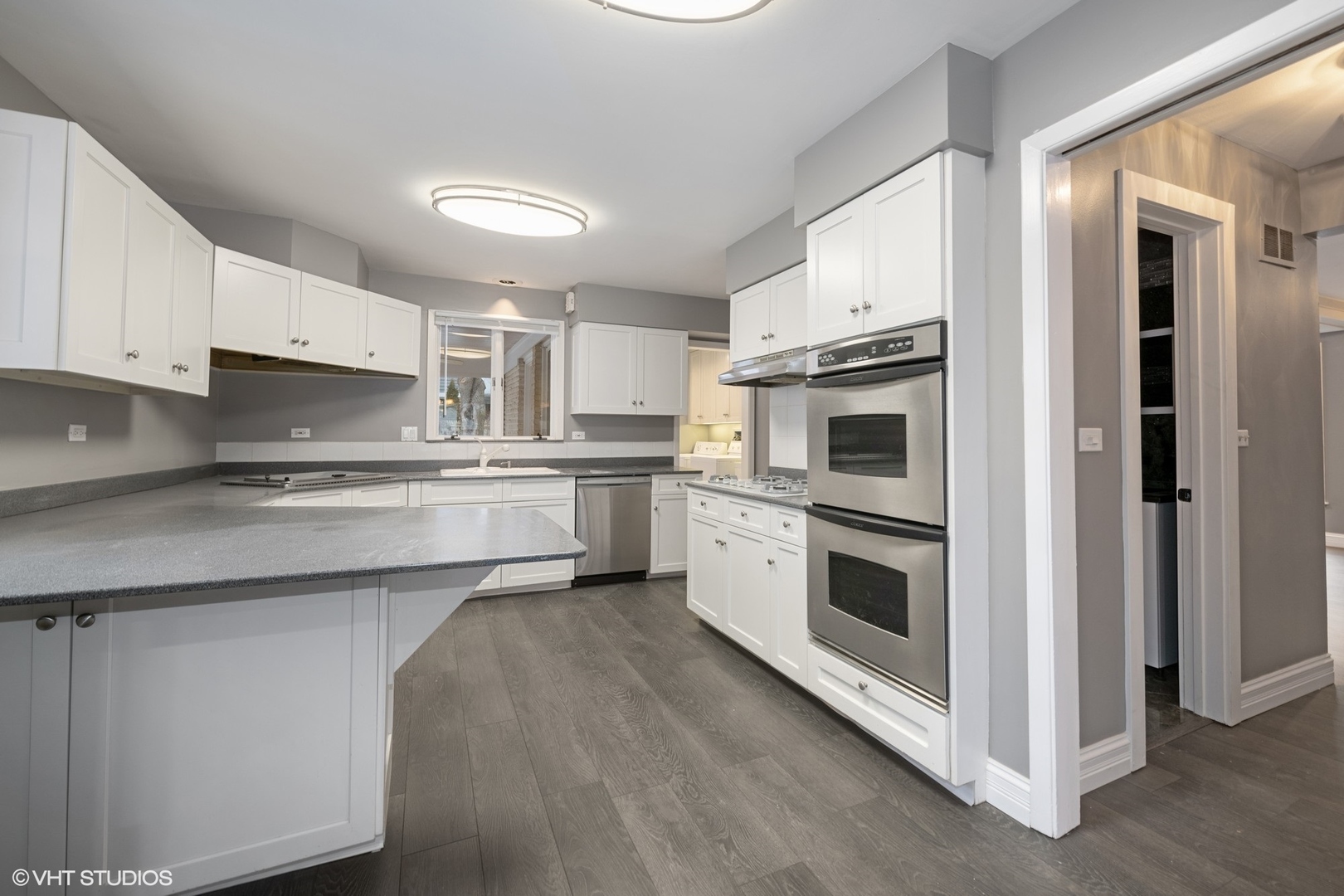 643 Robin Lane Glencoe, IL 60022 - Photo 11 of 32 a kitchen with stainless steel appliances white cabinets and a sink