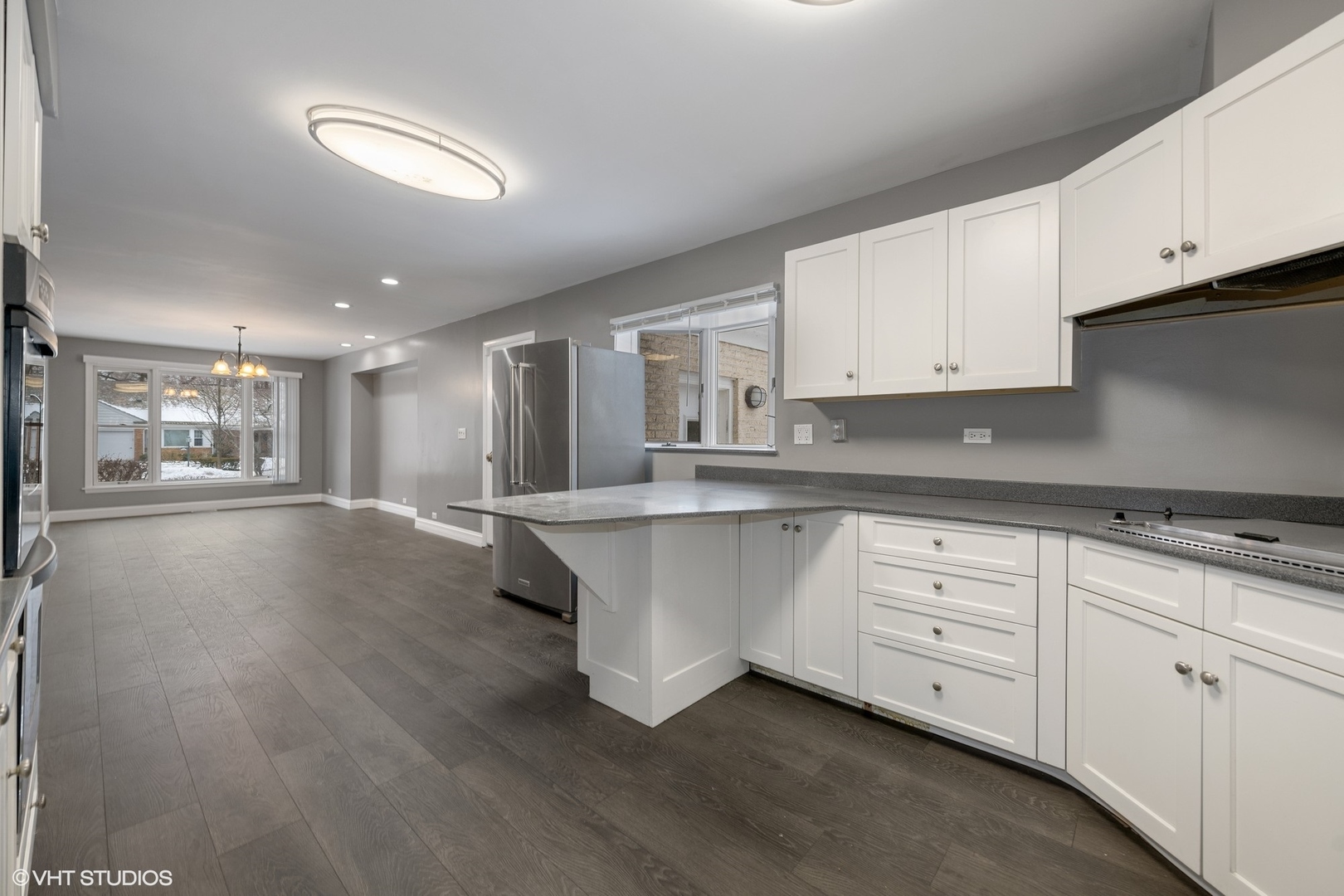 643 Robin Lane Glencoe, IL 60022 - Photo 13 of 32 a kitchen with stainless steel appliances granite countertop a stove a sink and white cabinets