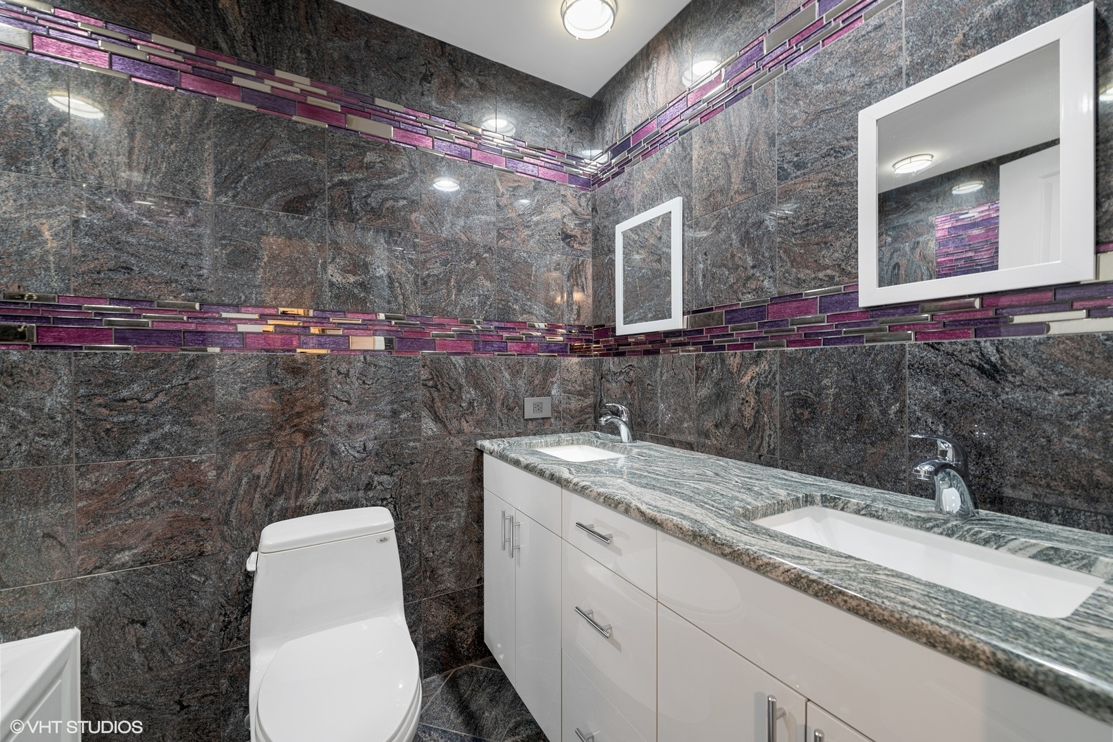 643 Robin Lane Glencoe, IL 60022 - Photo 18 of 32 a bathroom with a granite countertop sink mirror vanity and toilet