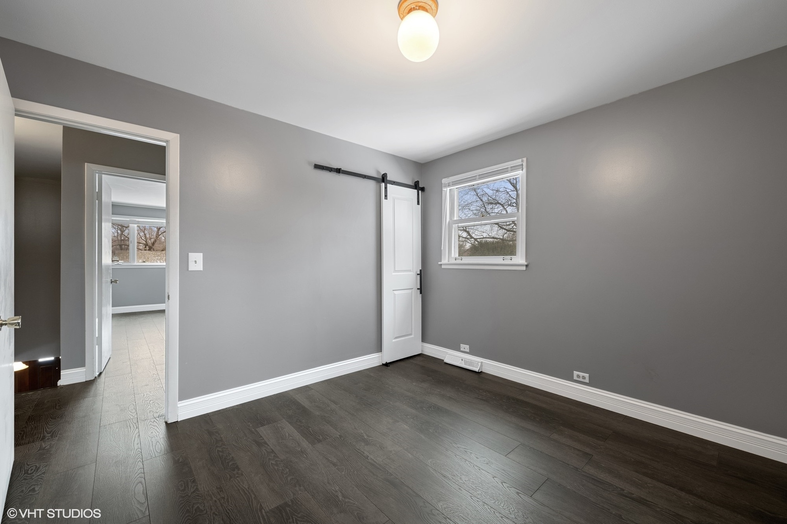 643 Robin Lane Glencoe, IL 60022 - Photo 20 of 32 an empty room with wooden floor and windows