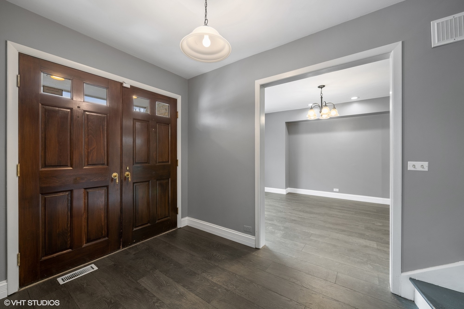 643 Robin Lane Glencoe, IL 60022 - Photo 2 of 32 an empty room with wooden floor mirror and windows