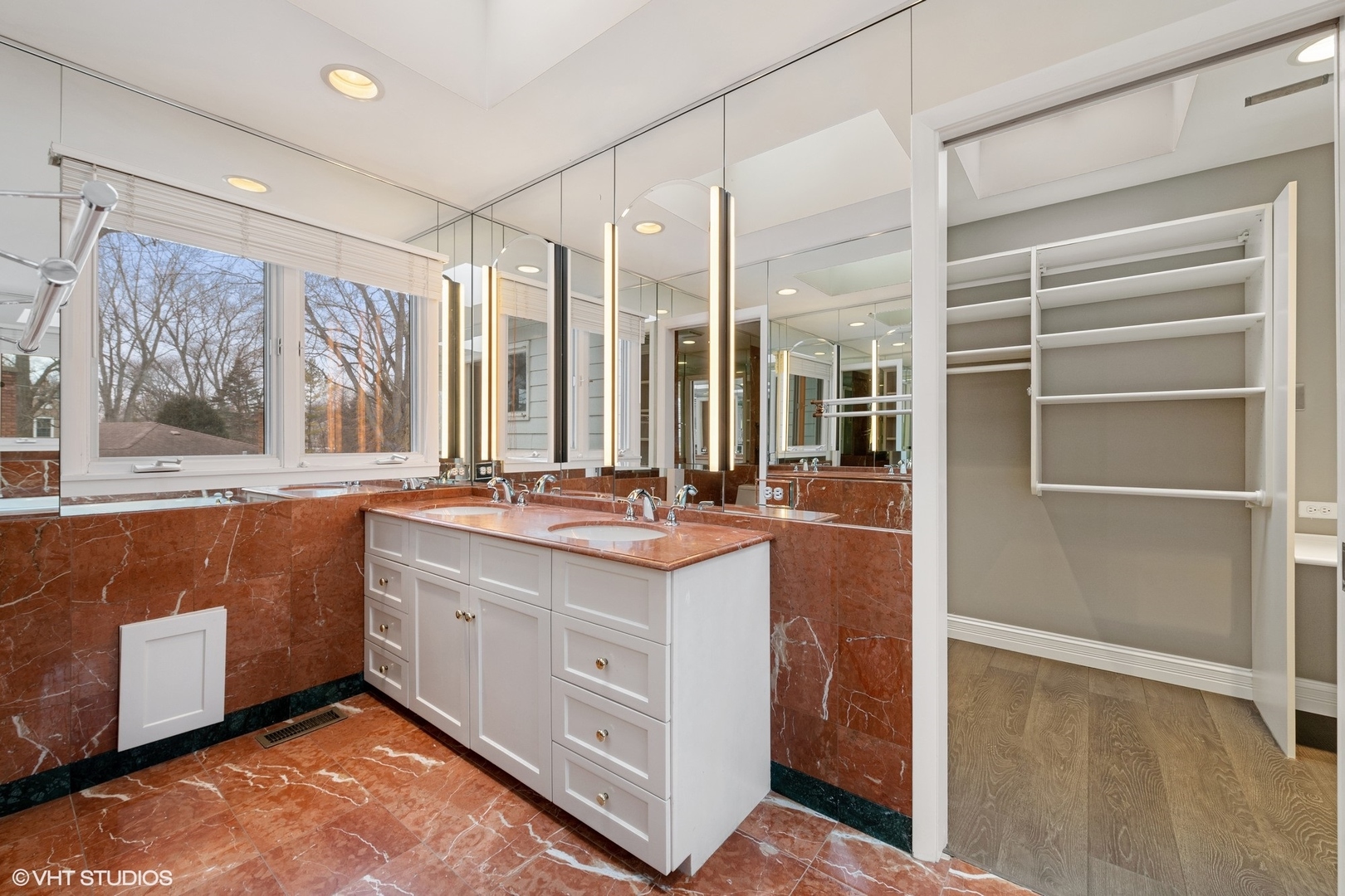 643 Robin Lane Glencoe, IL 60022 - Photo 25 of 32 a bathroom with a sink double vanity and a mirror