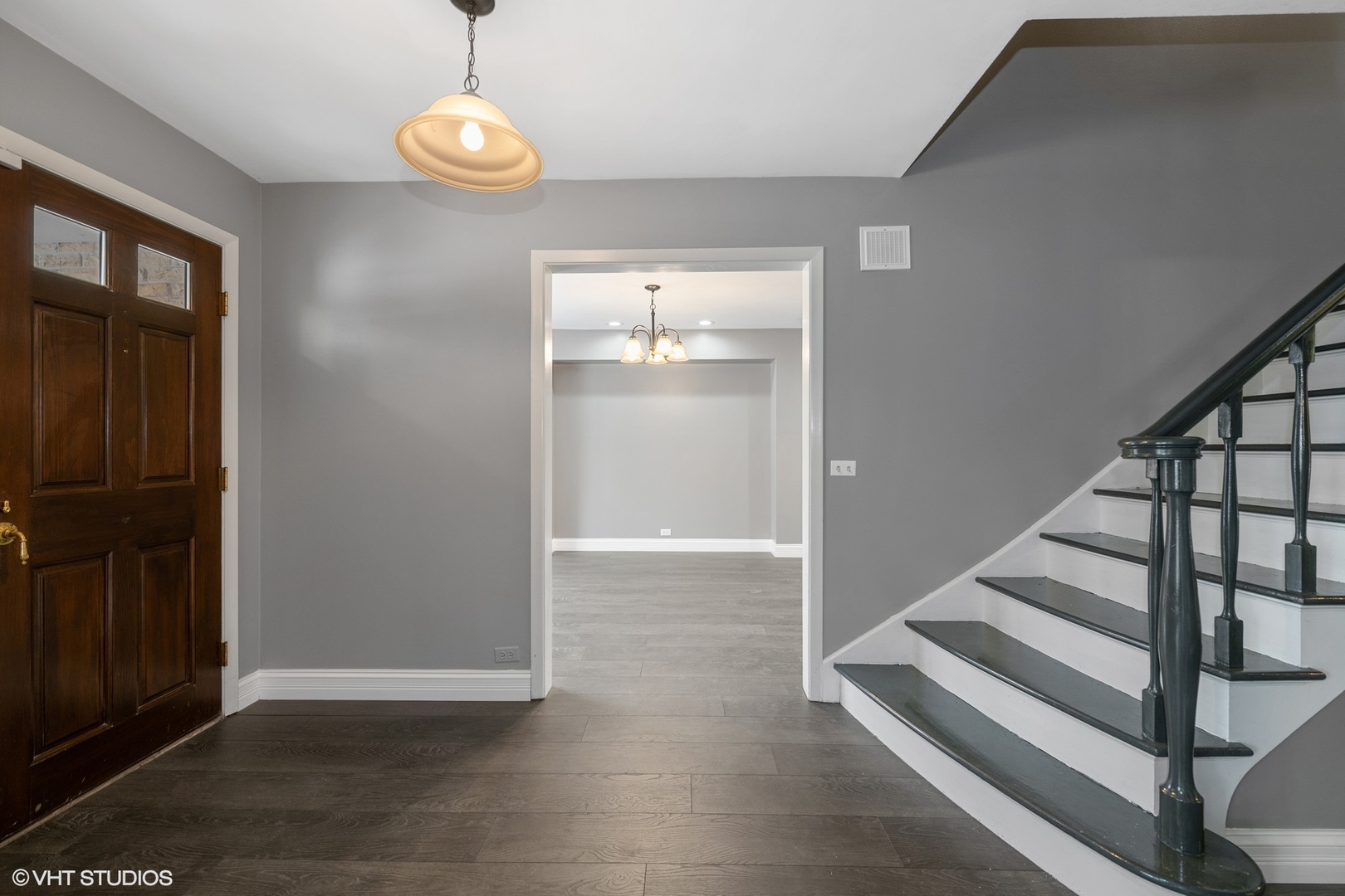 643 Robin Lane Glencoe, IL 60022 - Photo 3 of 32 an empty room with wooden floor mirror and windows