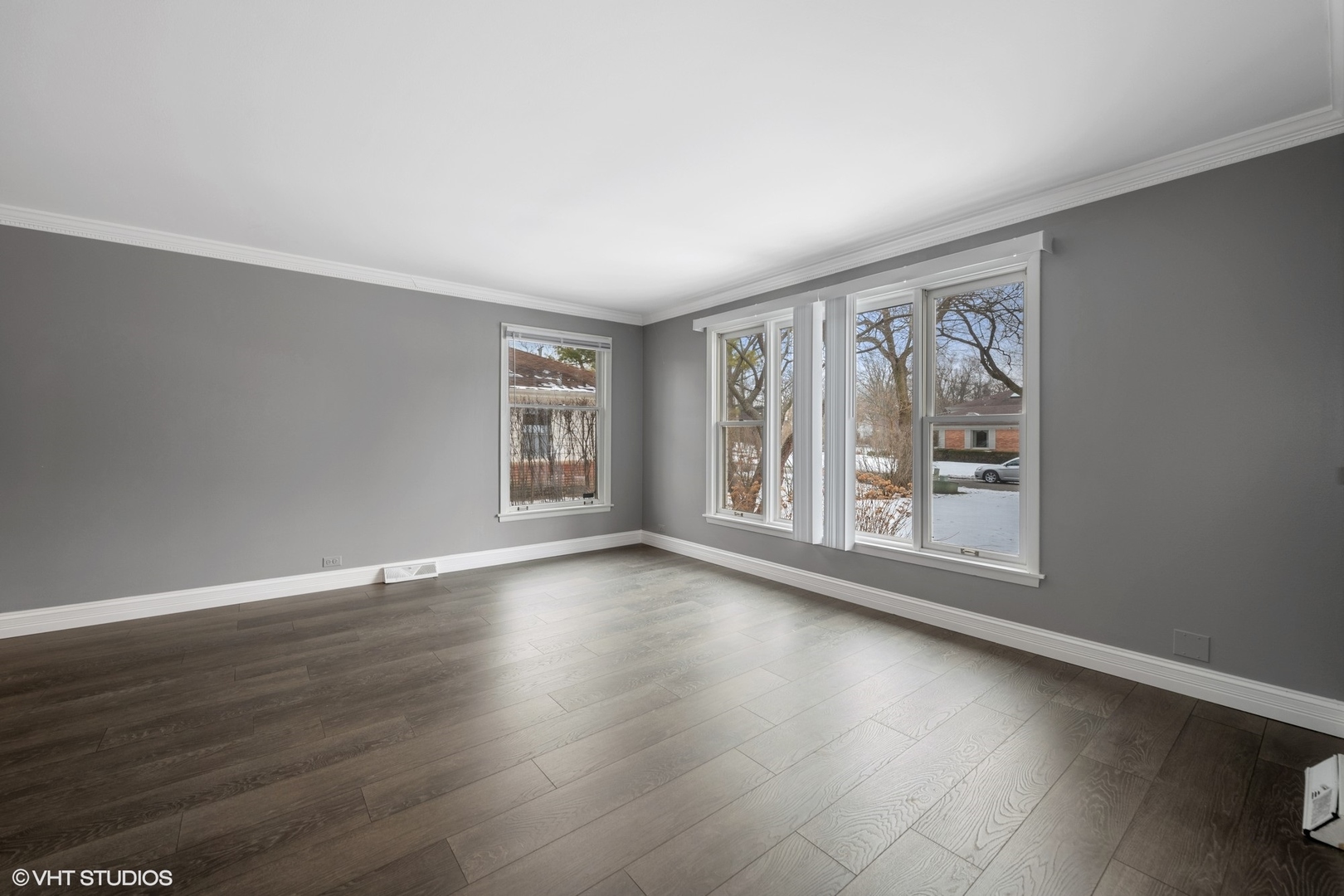 643 Robin Lane Glencoe, IL 60022 - Photo 4 of 32 a view of an empty room with wooden floor and a window